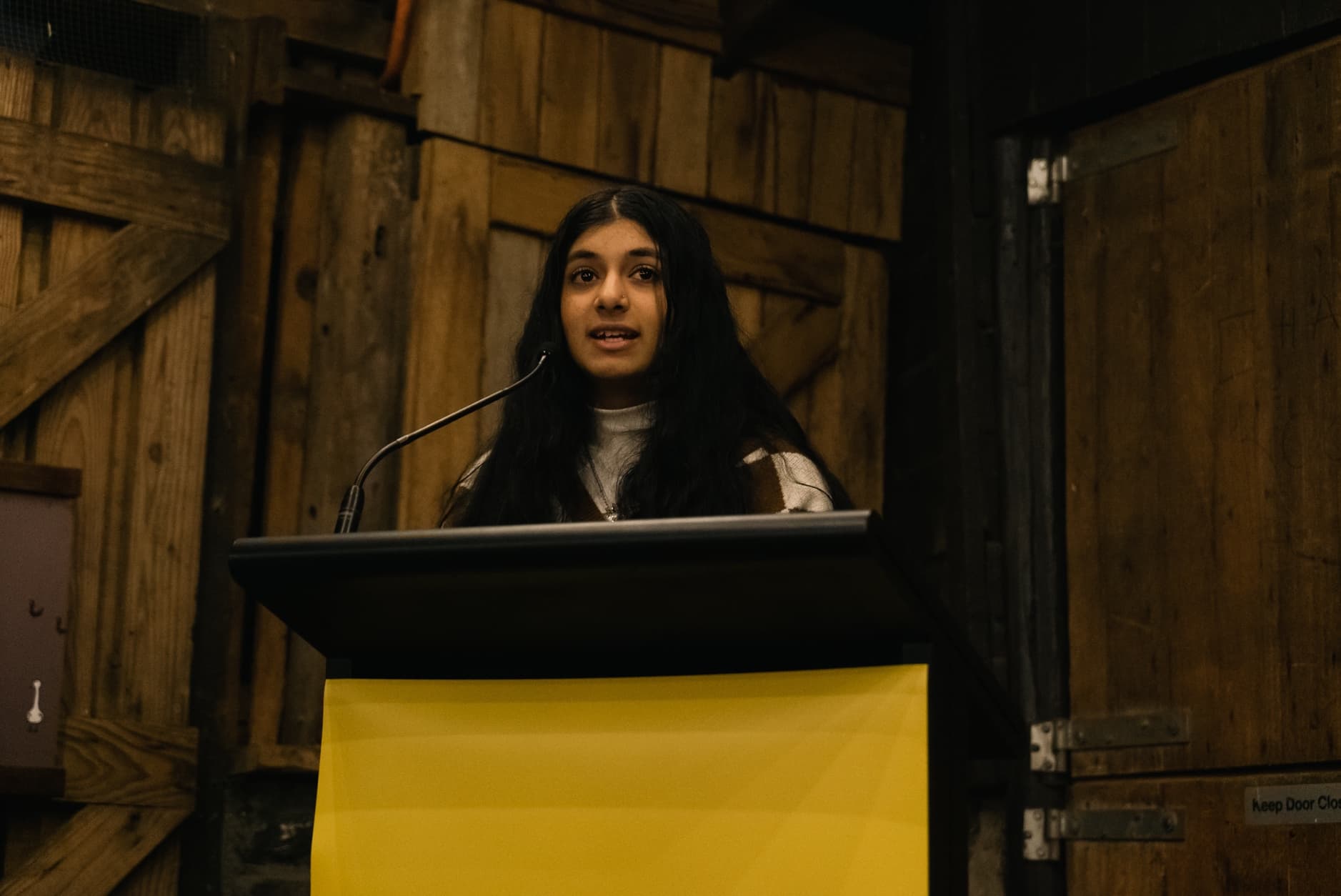 Anjali standing on a podium.